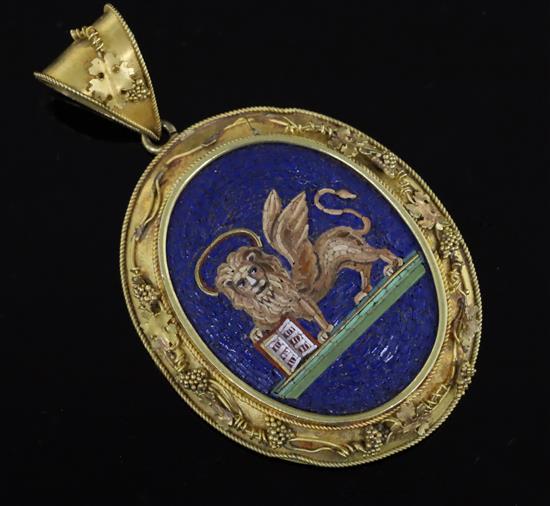 A Victorian gold mounted oval micro mosaic locket pendant, depicting the winged lion of St Mark, Venice, micro mosaic 32mm.